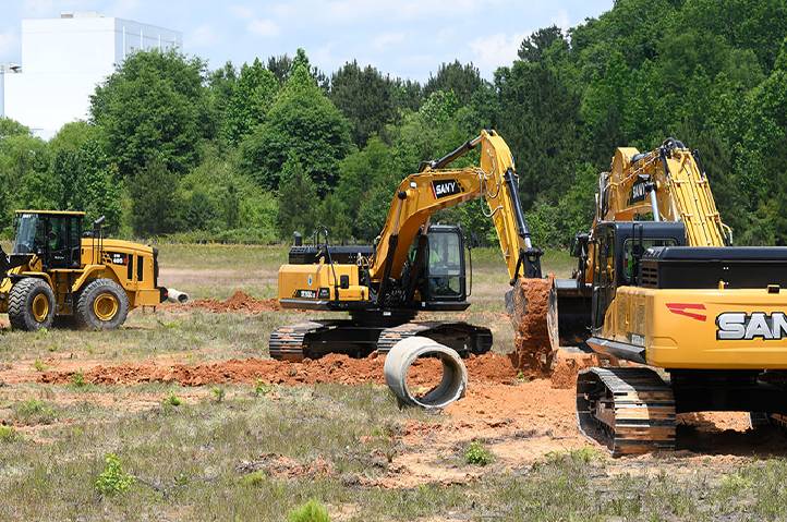 Excavators digging sand