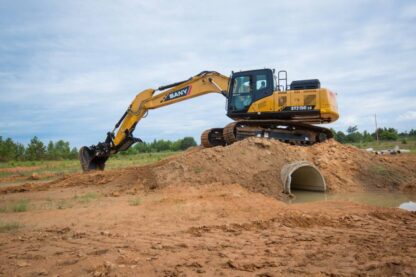 18-SY215C-working-side-view-water-culvert-horizontal-scaled